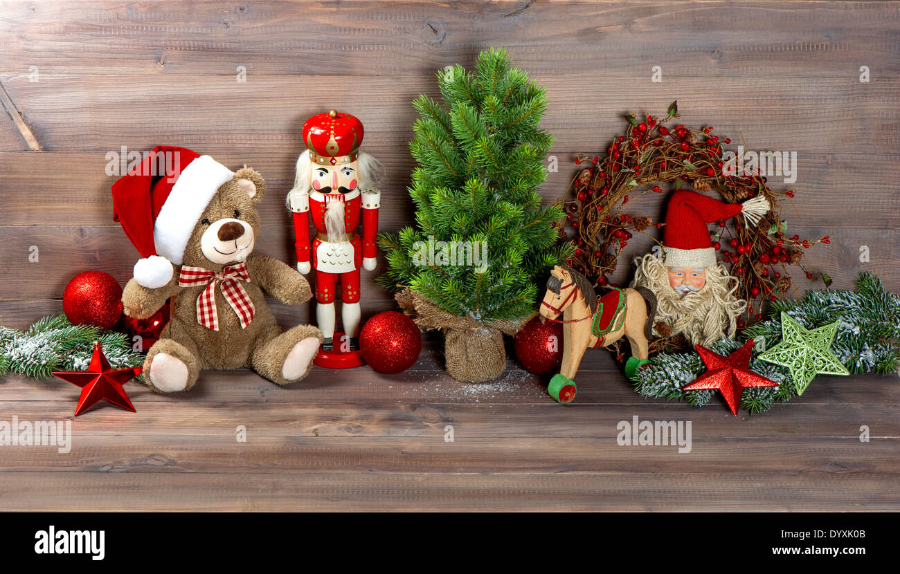 nostalgic christmas decoration with antique toys teddy bear and nutcracker. retro style picture Stock Photo