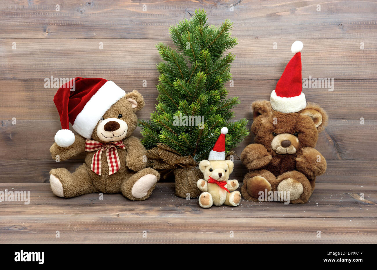nostalgic christmas decoration with vintage toys teddy bear family. retro style home interior Stock Photo