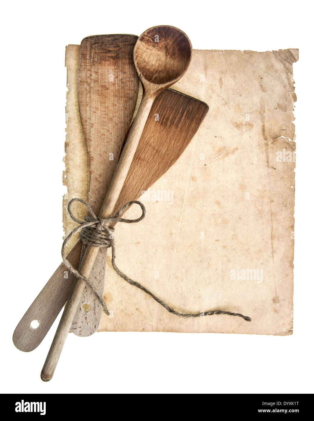 Vintage wooden kitchen utensils and old cookbook page isolated on white background. Grandma's recipies concept Stock Photo