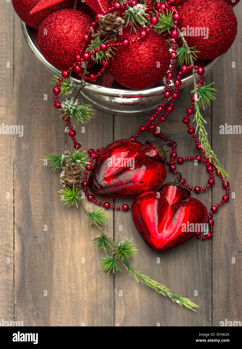 vintage christmas background with red baubles and hearts. festive home interior decoration Stock Photo