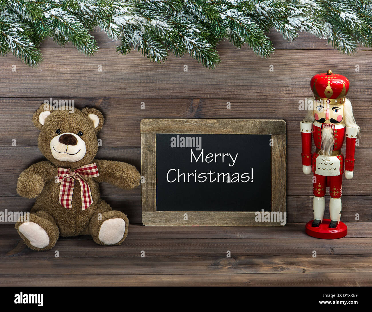 nostalgic christmas decoration with antique toys and blackboard with sample text Merry Christmas! retro style dark picture Stock Photo