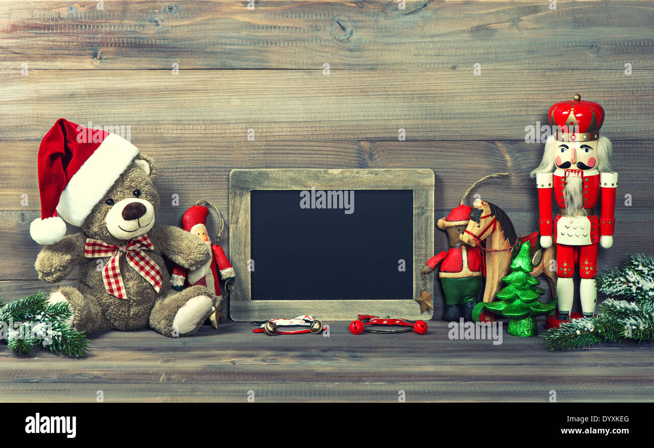 nostalgic christmas decoration with antique toys and blackboard for your text Stock Photo