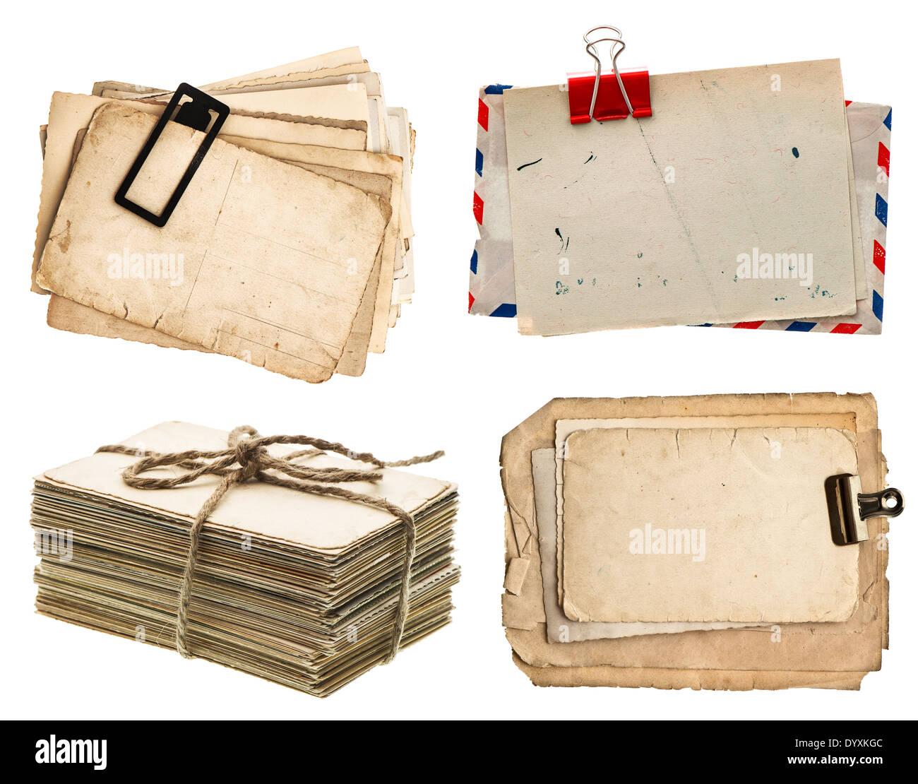pile of old postcards isolated on white background. vintage paper sheets with clip. air mail envelope. retro design Stock Photo
