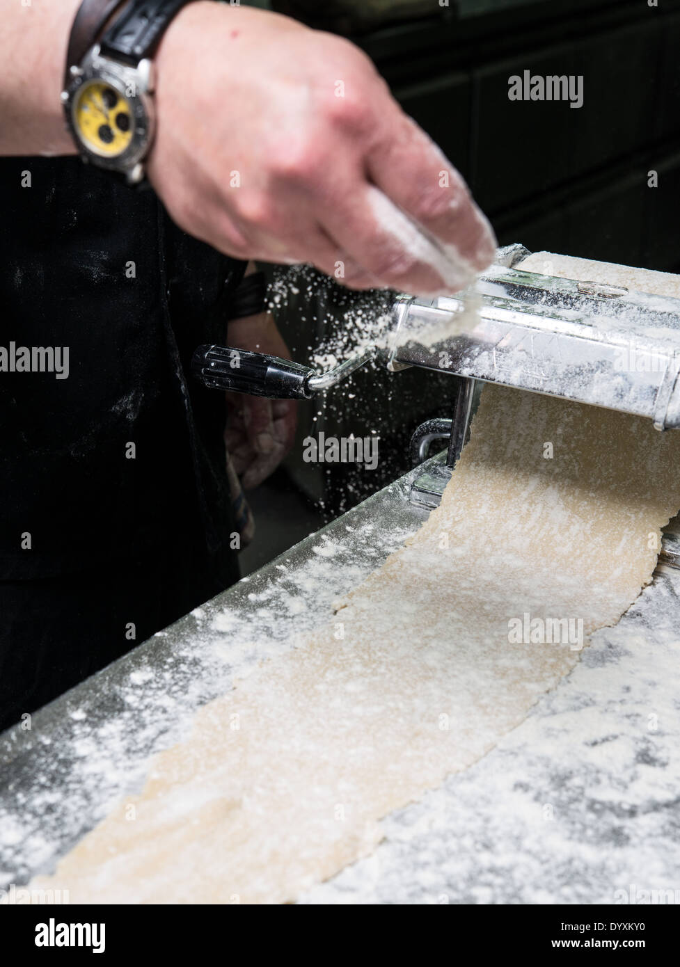 Making Tortellini pasta flattening the dough Stock Photo