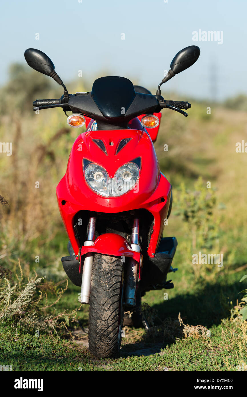 Motor Scooter in Grass Stock Photo Alamy
