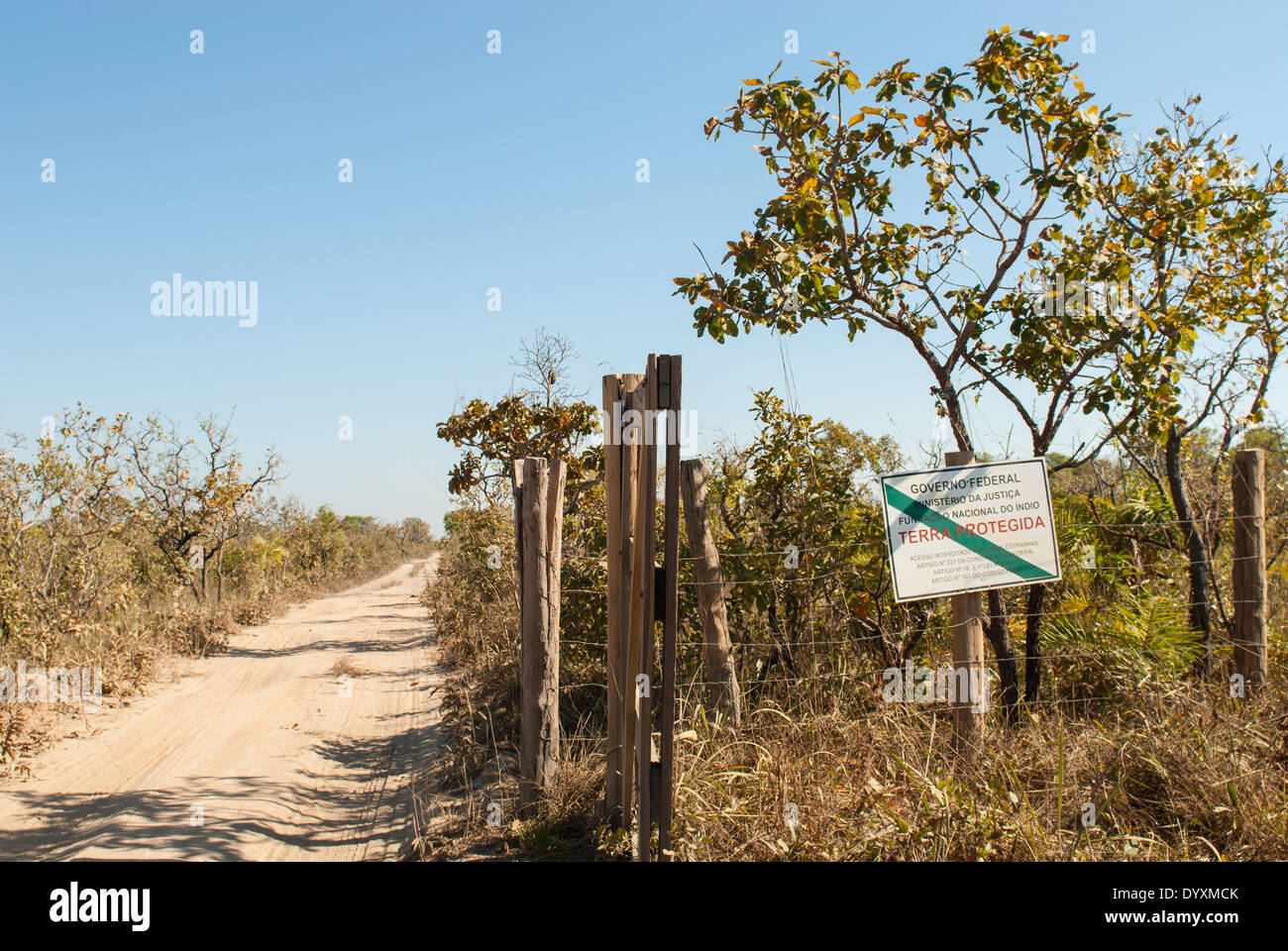 Mato Grosso State, Brazil. Entrance to the Indigenous Park of the Xingu with FUNAI sign 'Protected Land, no access for strangers'. Stock Photo