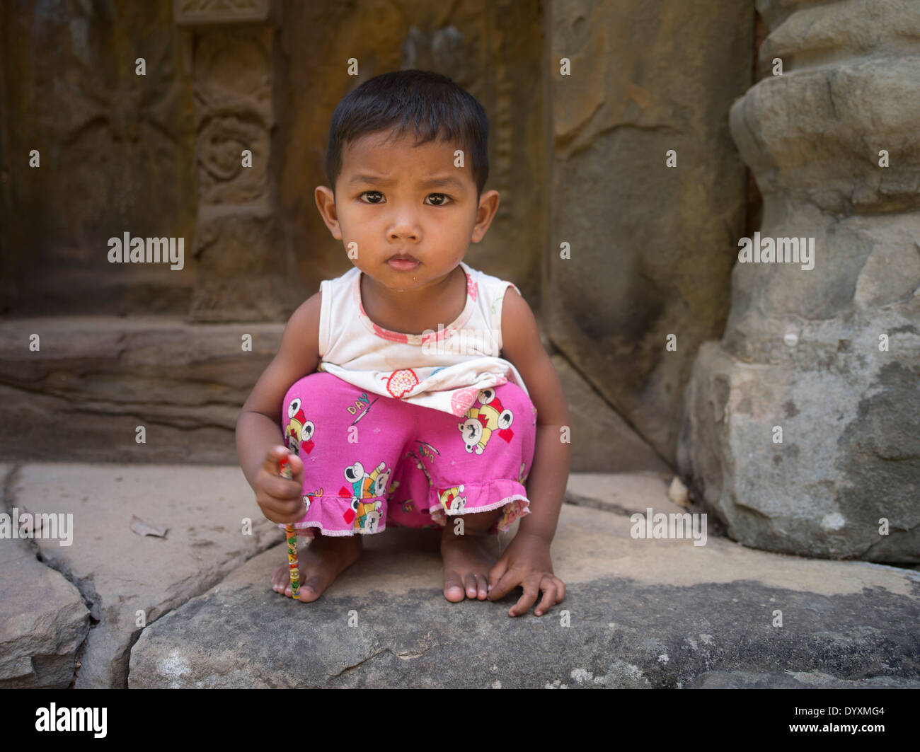 Young Cambodian girl at Preah Ko Temple ( Roluos Group ) , Siem Reap, Cambodia Stock Photo