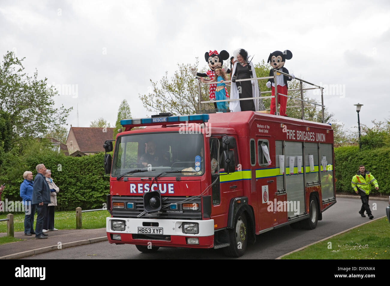 Biggin Hill, London, UK. 27th Apr, 2014. A fire engine with Disney characters on top led a procession of the Positive Path walkers who are raising money for the the Chartwell Cancer Trust Credit:  Keith Larby/Alamy Live News Stock Photo