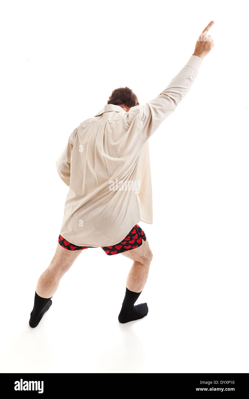 Middle aged man dancing around in his socks, shirt, and underwear