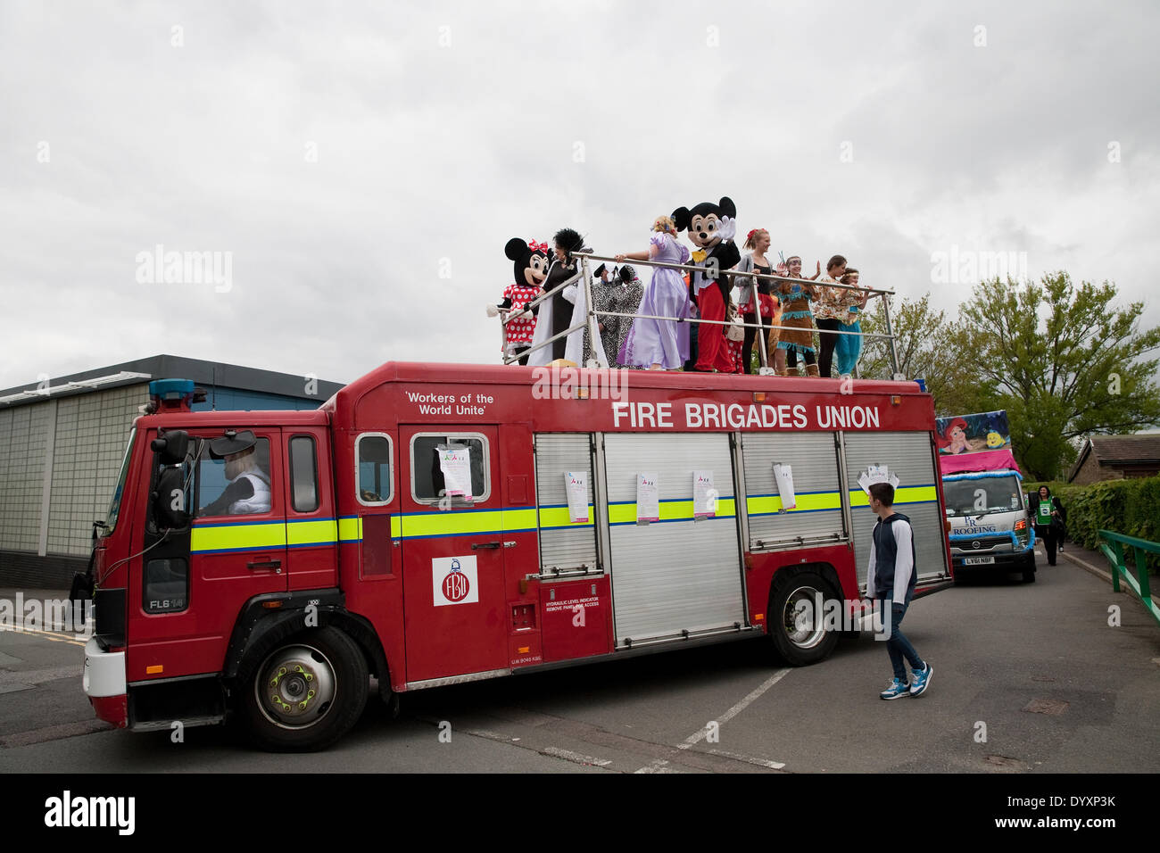 Biggin Hill,UK,27th April 2014, A fire engine with Disney characters on top led a procession of the Positive Path walkers who are raising money for the the Chartwell Cancer Trus Credit: Keith Larby/Alamy Live News Stock Photo
