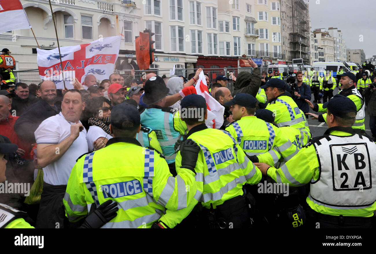 Trouble flares at the March for England Rally in Brighton today as a smoke flare is thrown by anti fascist protesters Stock Photo