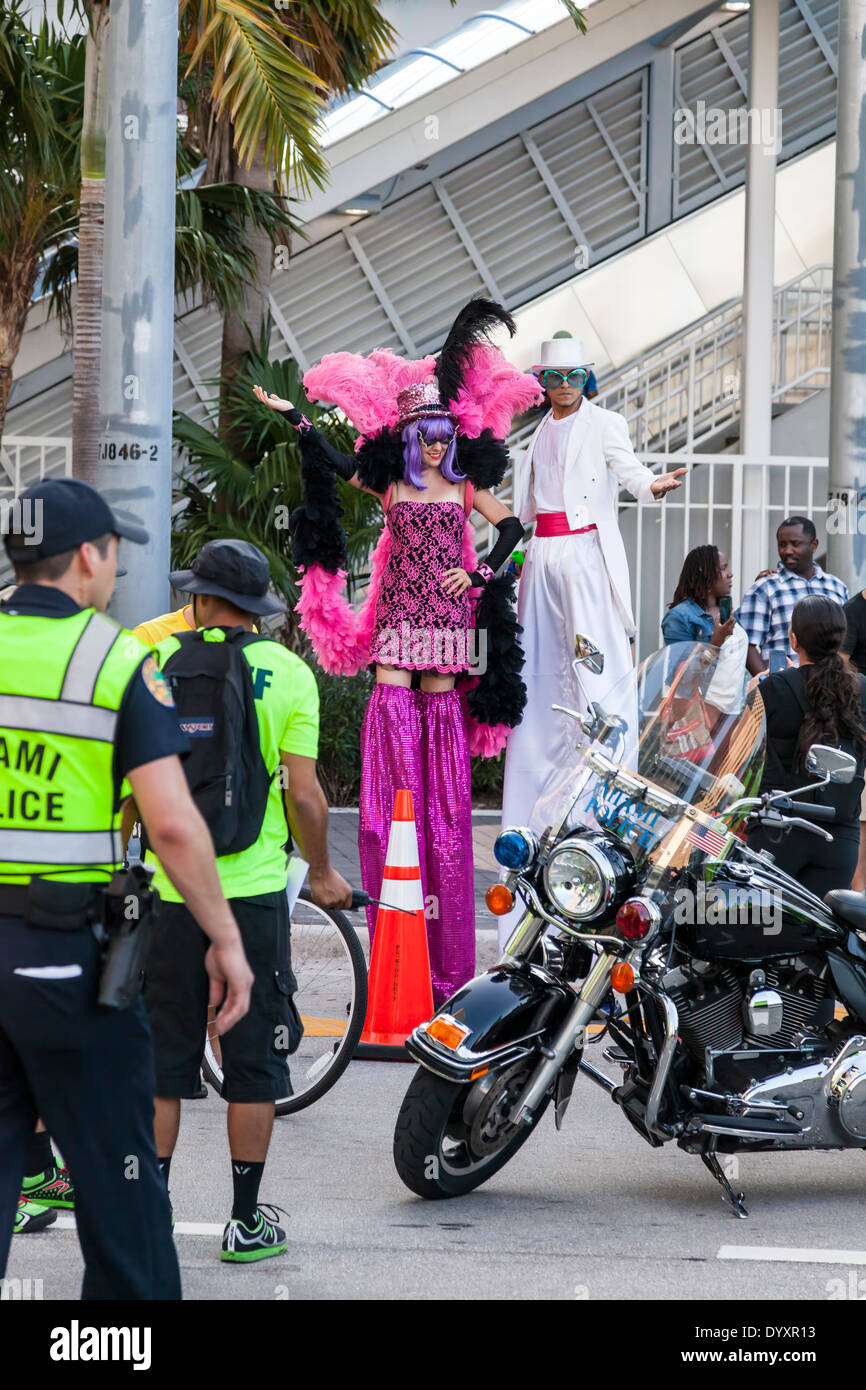 Male and female stilt walkers in colorful costumes at 2014 Mercedes