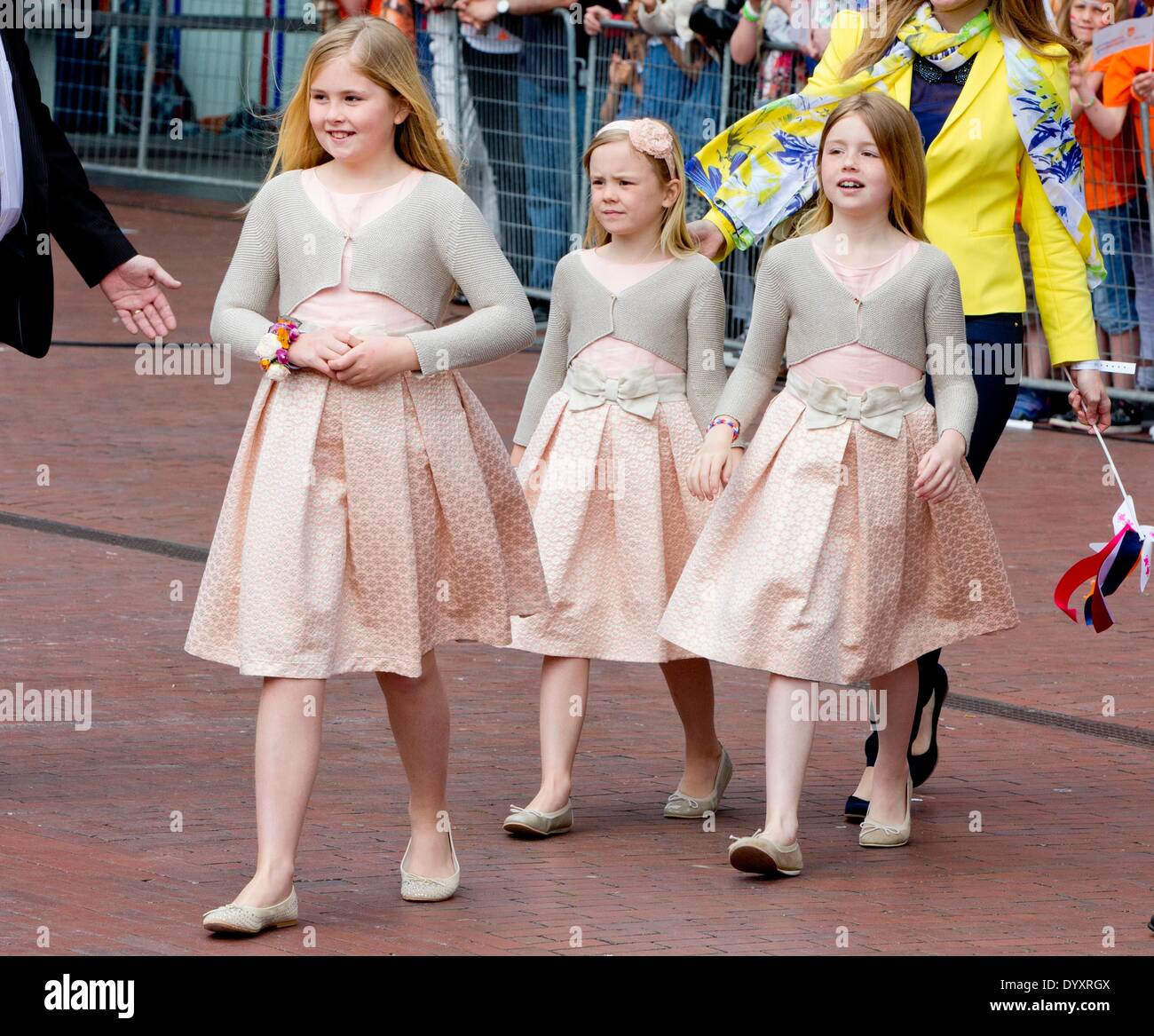 De Rijp, The Netherlands. 26th Apr, 2014. Dutch Crown Princess Amalia (L), Princess Alexia (R) and Princess Ariane with the nanny attend the King's Day (Koningsdag) celebrations in De Rijp, The Netherlands, 26 April 2014. The Dutch Royal family celebrates the birthday of the King on 27 April at King' s Day. Photo: Patrick van Katwijk/ - NO WIRE SERVICE/dpa/Alamy Live News Stock Photo
