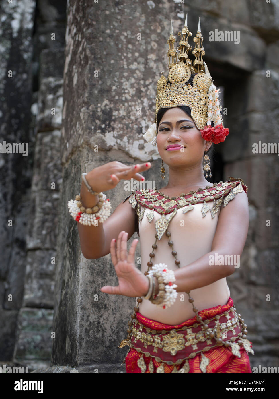 Khmer Dancer in Apsara costume at Bayon Temple within the walls of Angkor Thom, Siem Reap, Cambodia Stock Photo