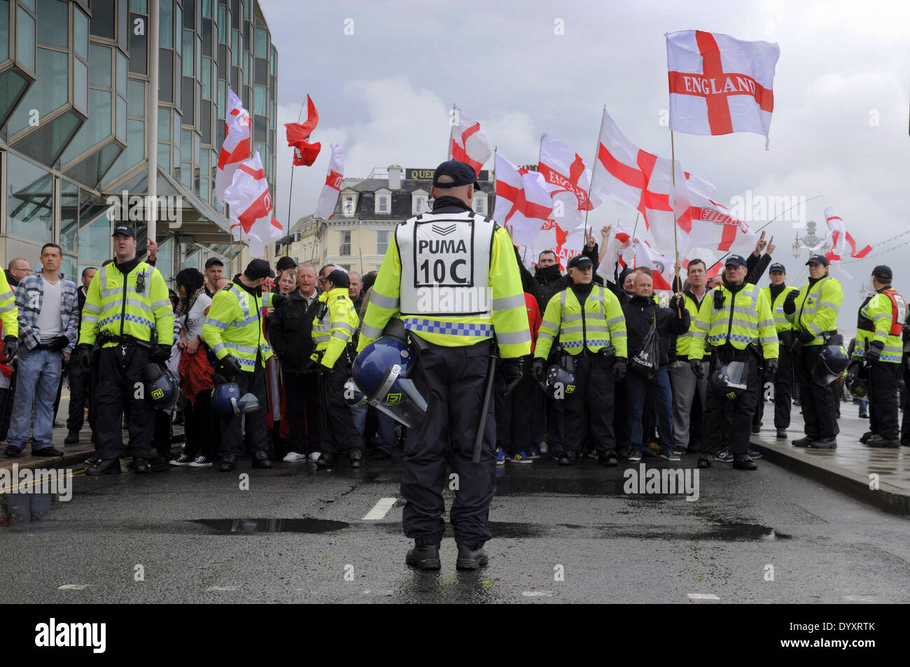 Brighton, East Sussex, UK. 27 April 2014. The centre of Brighton was brought to a standstill this afternoon as Police kept rival factions apart. About 150 marchers were outnumbered by Police and those opposed to the March. Stock Photo
