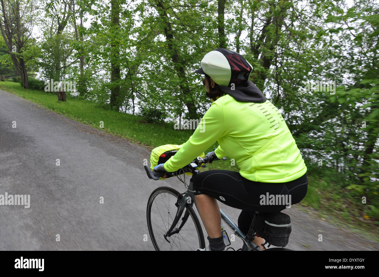 Australian cyclist on a cycling holiday riding through rural Ontario, Canada. Stock Photo