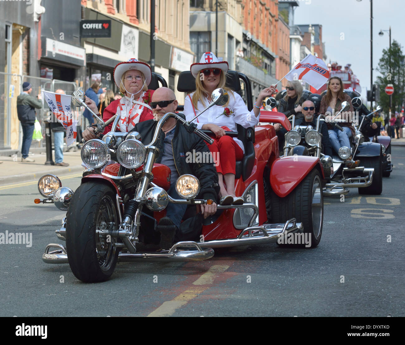 A motorbike takes part in the St Day Parade , which passes