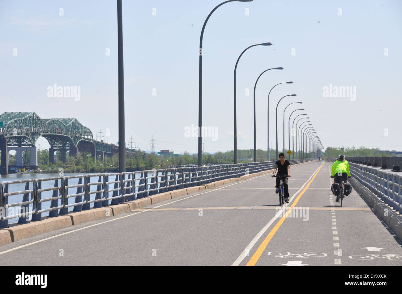 Cyclists using the Estacade upstream of the Champlain Bridge, Montreal. Stock Photo