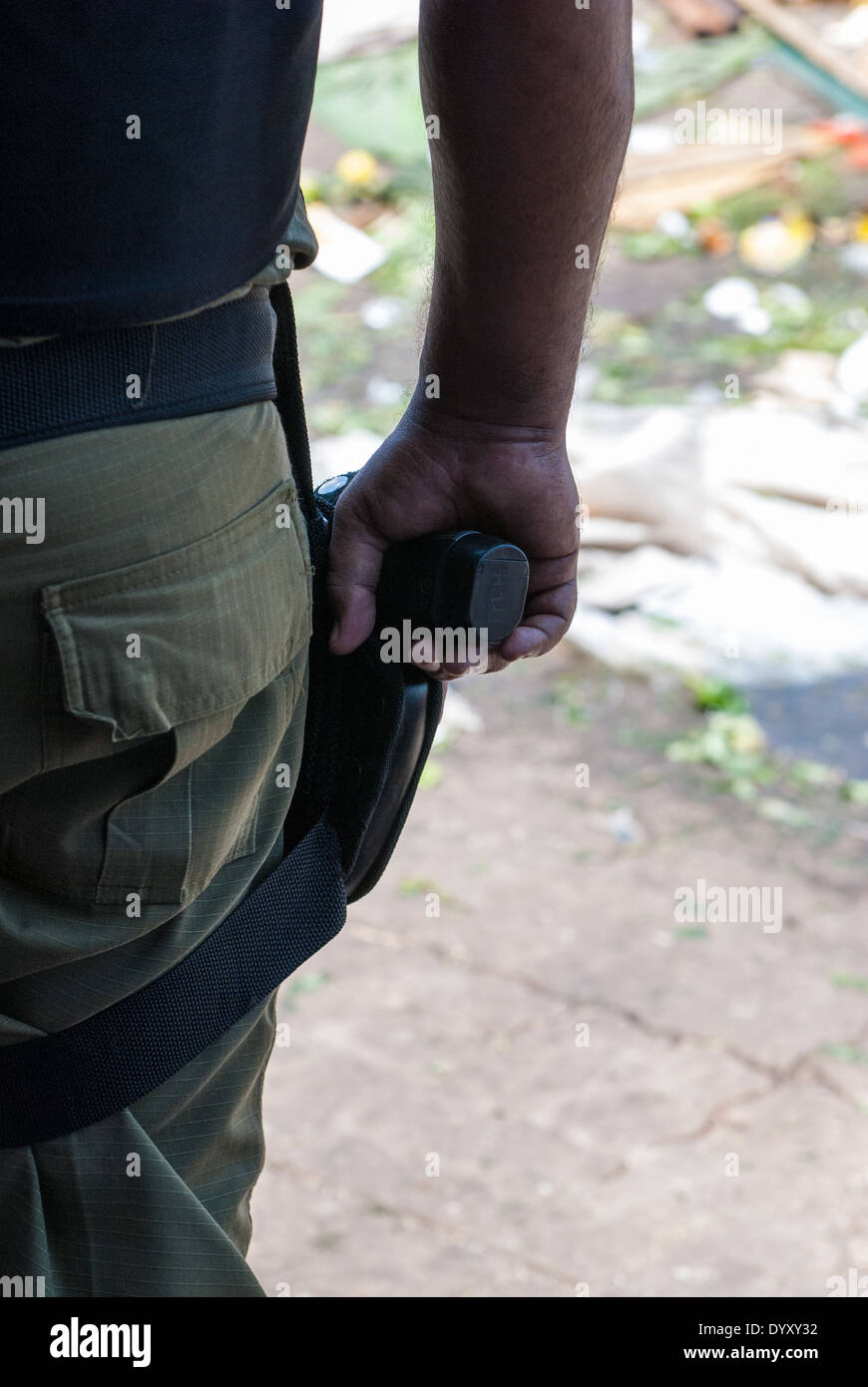 Belem, Para State, Brazil. Armed Police hand gun during a demonstration against the construction of the Belo Monte hydroelectric dam, 20th August 2011. Stock Photo