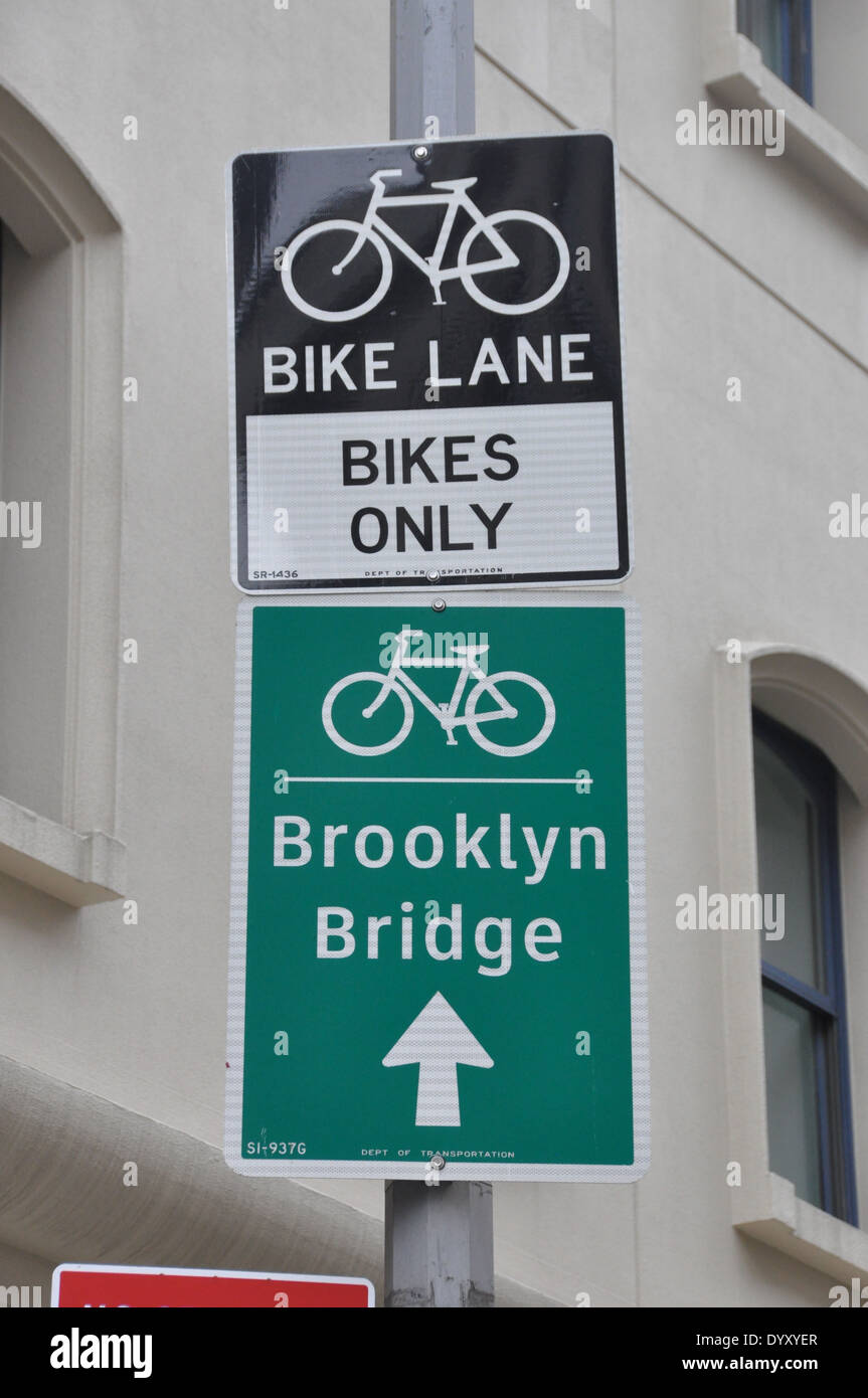 Bike signs to Brooklyn Bridge from Hudson River Greenway. Stock Photo