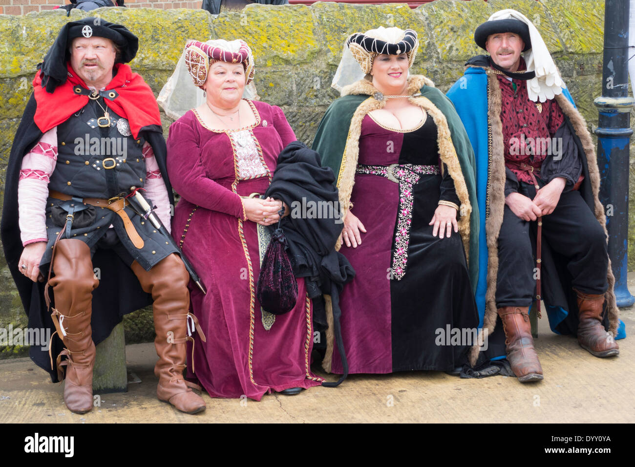 Two men and their women partners in Elizabethan Gothic dress  at the Whitby Goth Week End spring 2014 Stock Photo