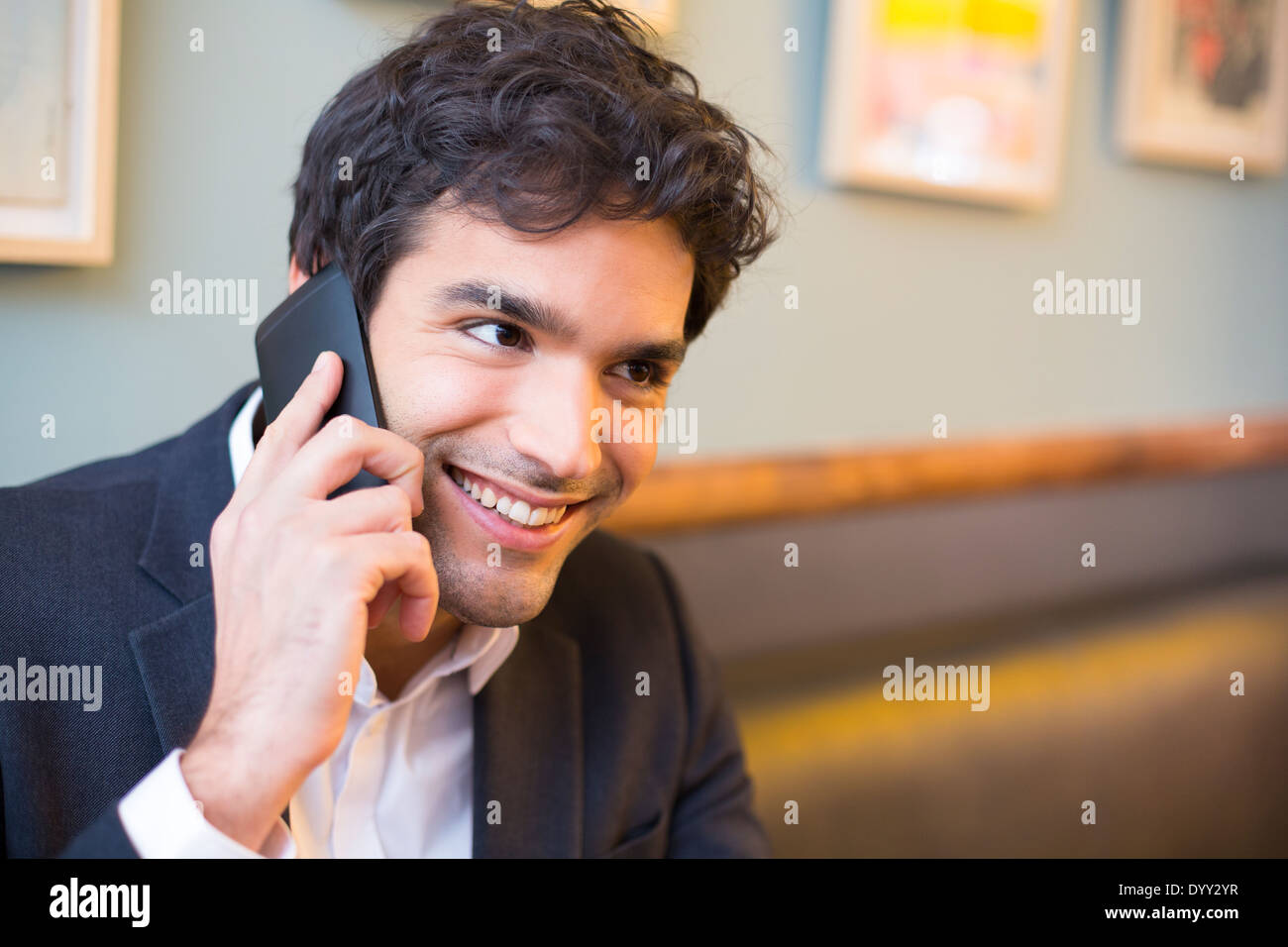 smiling male cheerful restaurant smartphone Stock Photo