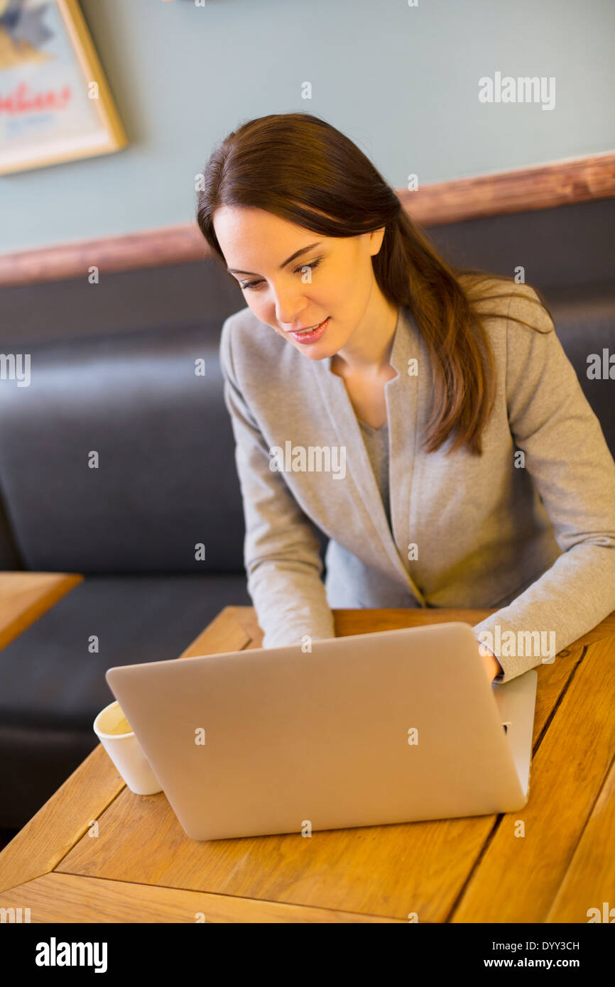 female businesswoman laptop restaurant Stock Photo