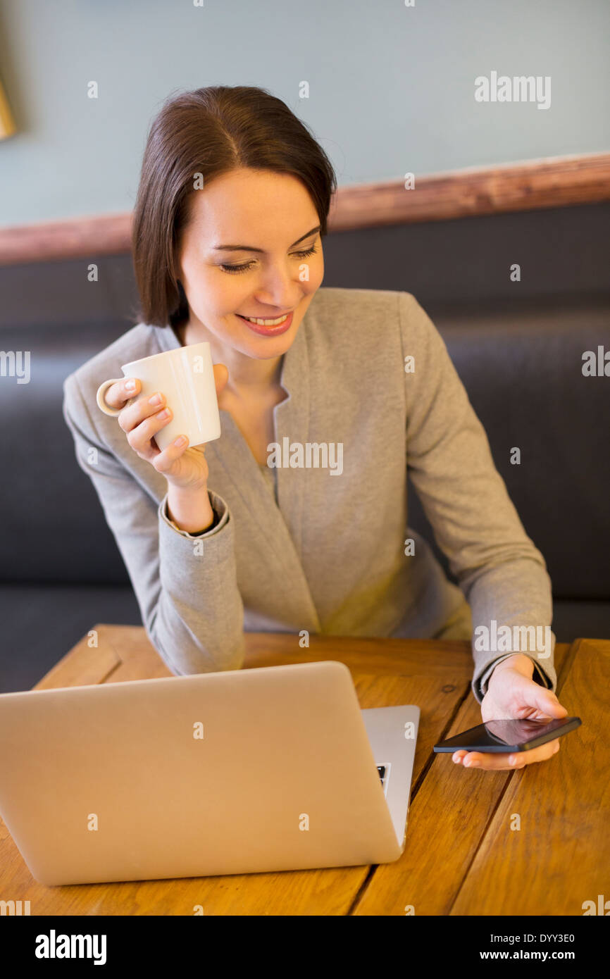 female businesswoman laptop restaurant Stock Photo