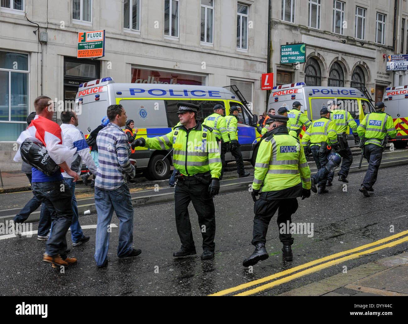 Brighton, East Sussex, UK..27th April 2014..About 150 marchers descended on Brighton. Completely outnumbered by those opposed to the march Police did a commendable  job keeping the two factions apart. Stock Photo