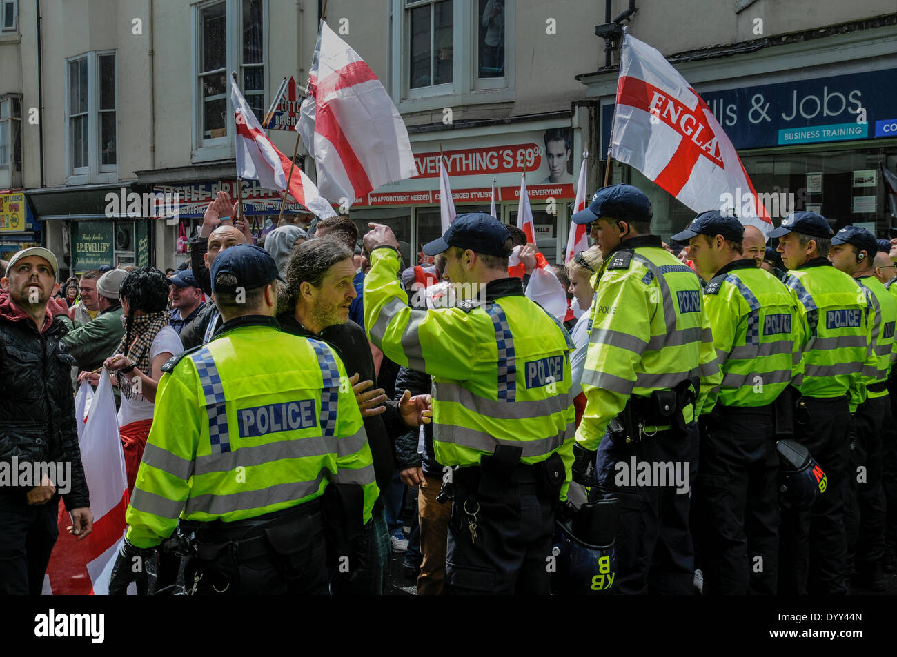 Brighton, East Sussex, UK..27th April 2014..About 150 marchers descended on Brighton. Completely outnumbered by those opposed to the march Police did a commendable  job keeping the two factions apart. Stock Photo