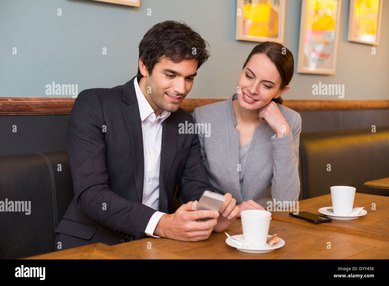 Female male coffee bar cell phone Stock Photo
