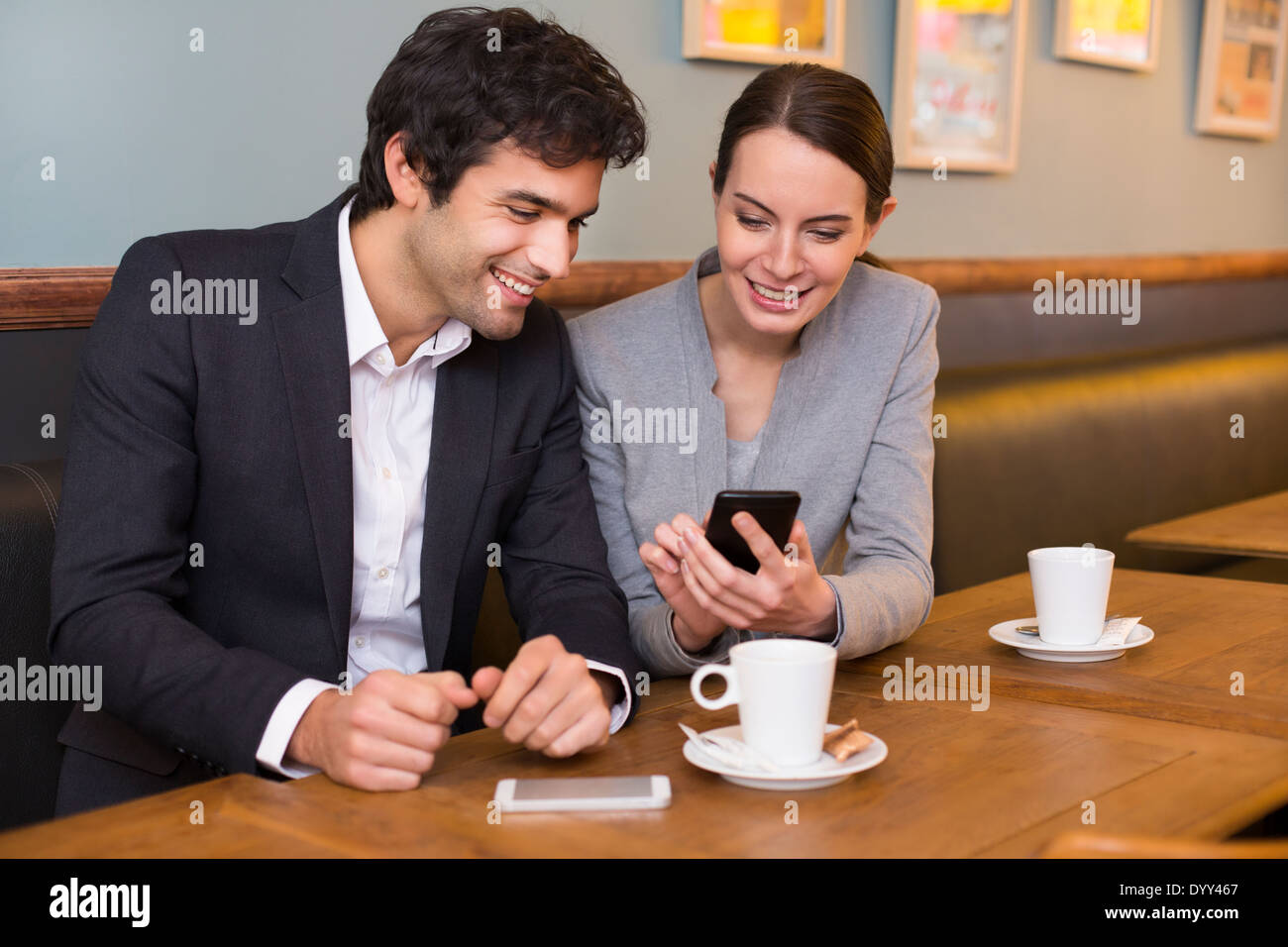 Female male coffee bar cell phone Stock Photo