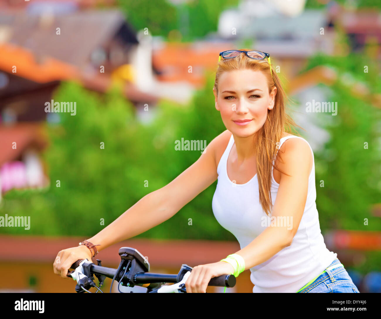 Portrait of happy woman resting in countryside, enjoying European tour on bicycle, extreme sport, happy summer holidays concept Stock Photo