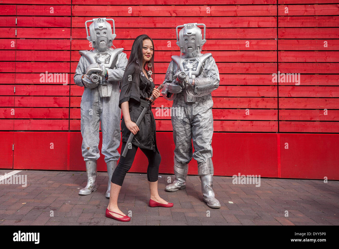 London, 27 April 2014 - people dressed as their favourite sci-fi characters take part in the Sci-Fi London 2014 costume parade starting at Somerset House and finishing at the BFI on the South Bank.  Two Cybermen and a girl dressed as a Japanese manga character.    Credit:  Stephen Chung/Alamy Live News Stock Photo