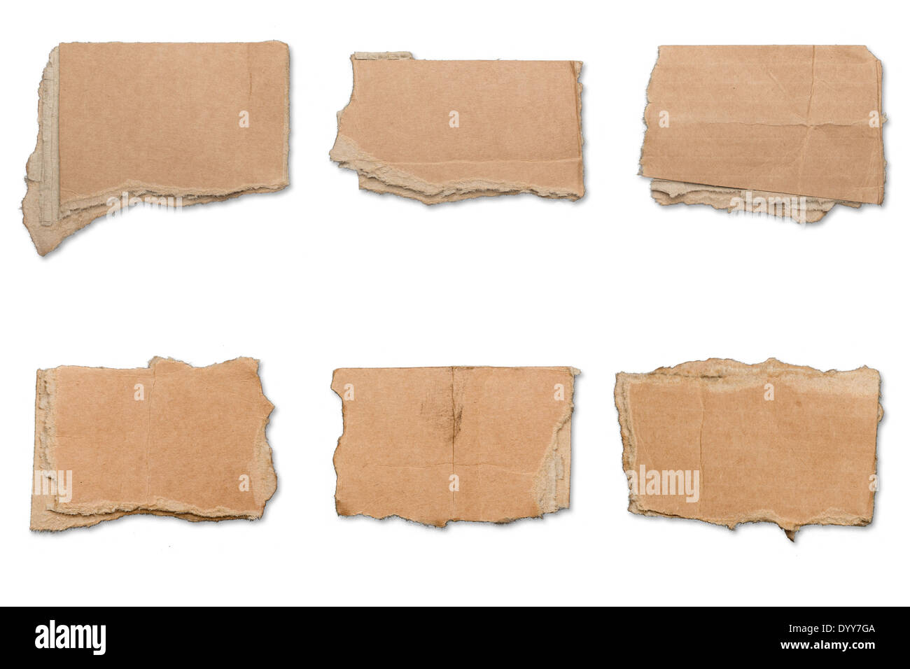 collection of ripped brown pieces of cardboard, shadows, isolated on white. Stock Photo