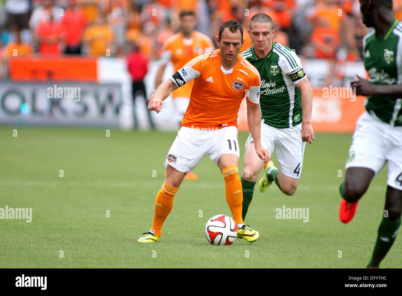 Houston, Texas, USA. 27th Apr, 2014. APR 27 2014: Houston Dynamo midfielder Brad Davis #11 plays the ball forward during the MLS soccer match between the Houston Dynamo and the Portland Timbers from BBVA Compass Stadium in Houston, TX. The match ended in a 1-1 draw. Credit:  csm/Alamy Live News Stock Photo