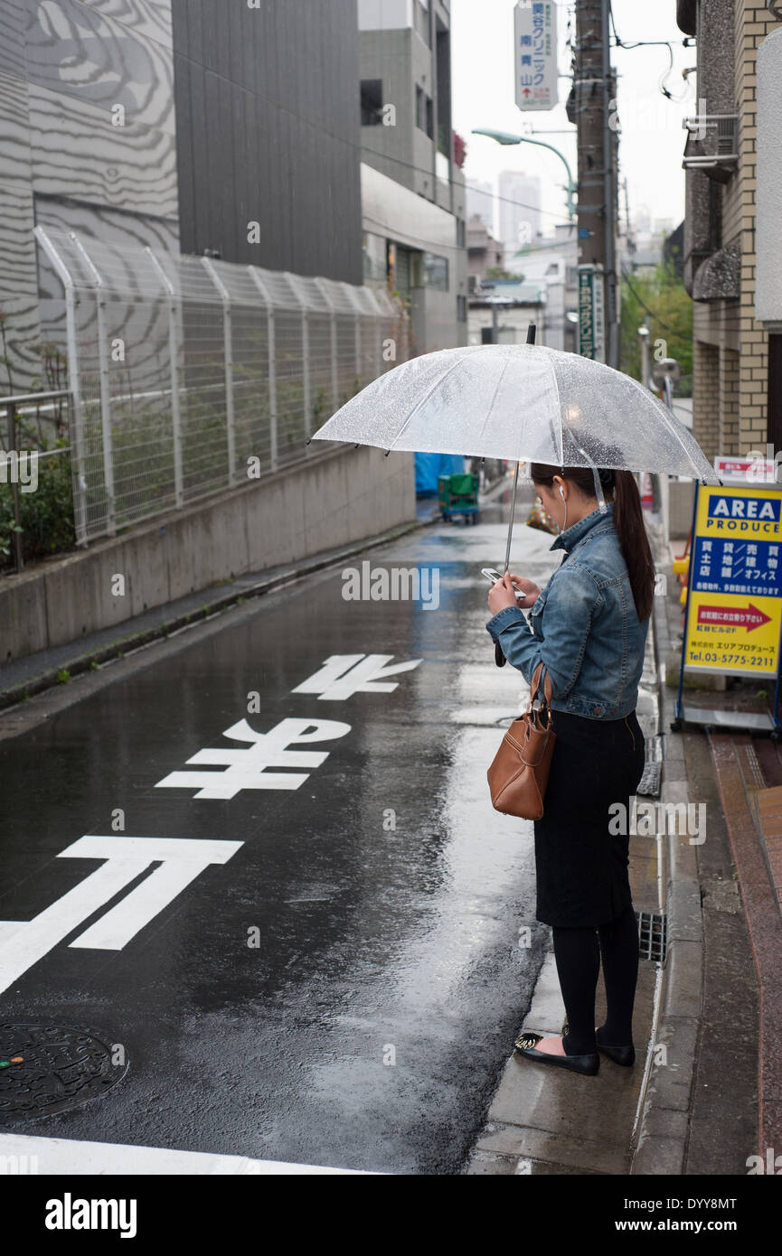 Woman with umbrella in Aoyama, Tokyo, Japan Stock Photo