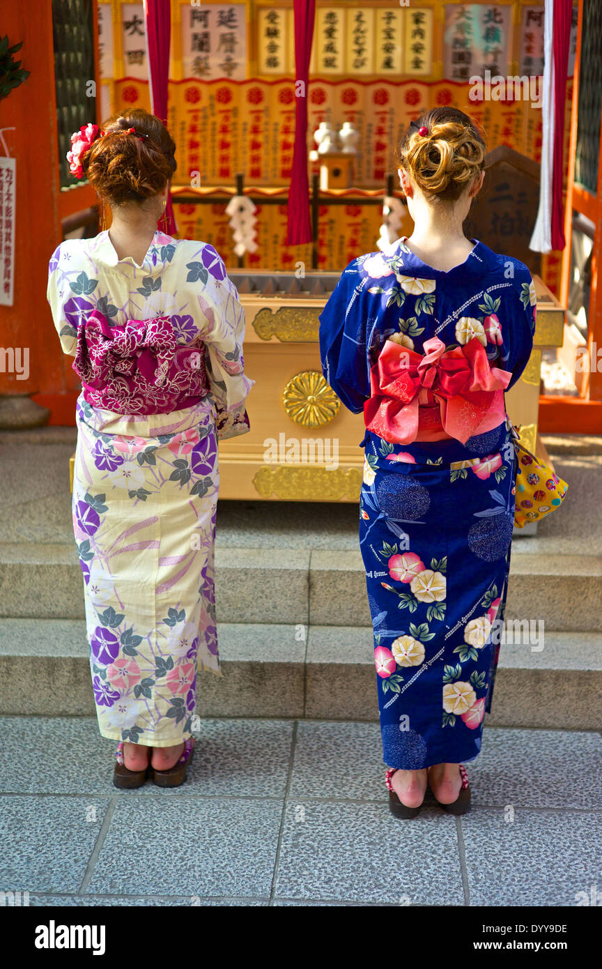 Japanese woman wearing traditional kimonos entering the ¨Love Shrine¨ at the Kiyomizu Temple. Stock Photo