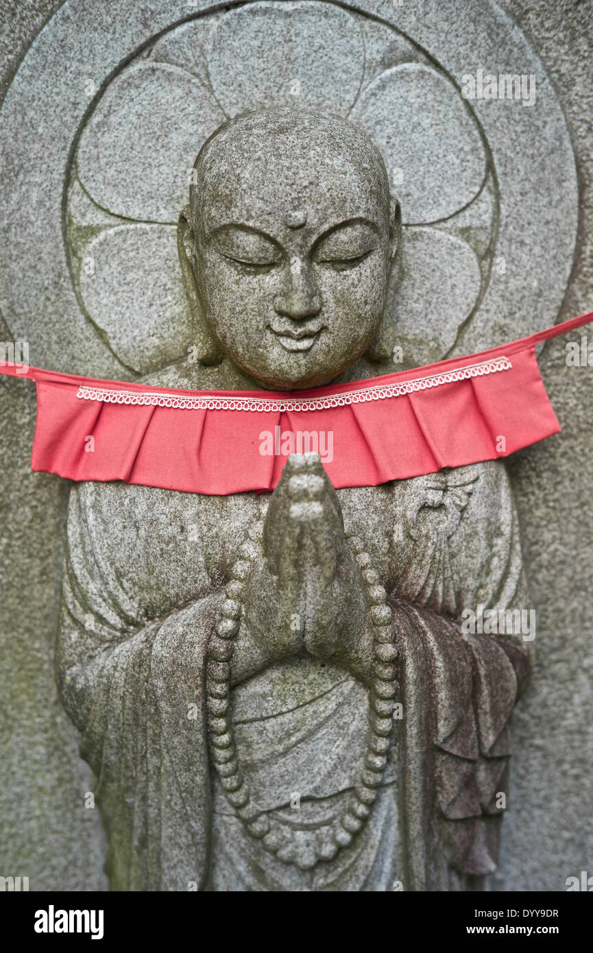Buddhist statue carved on rock at Kiyomizu-dera temple. Stock Photo