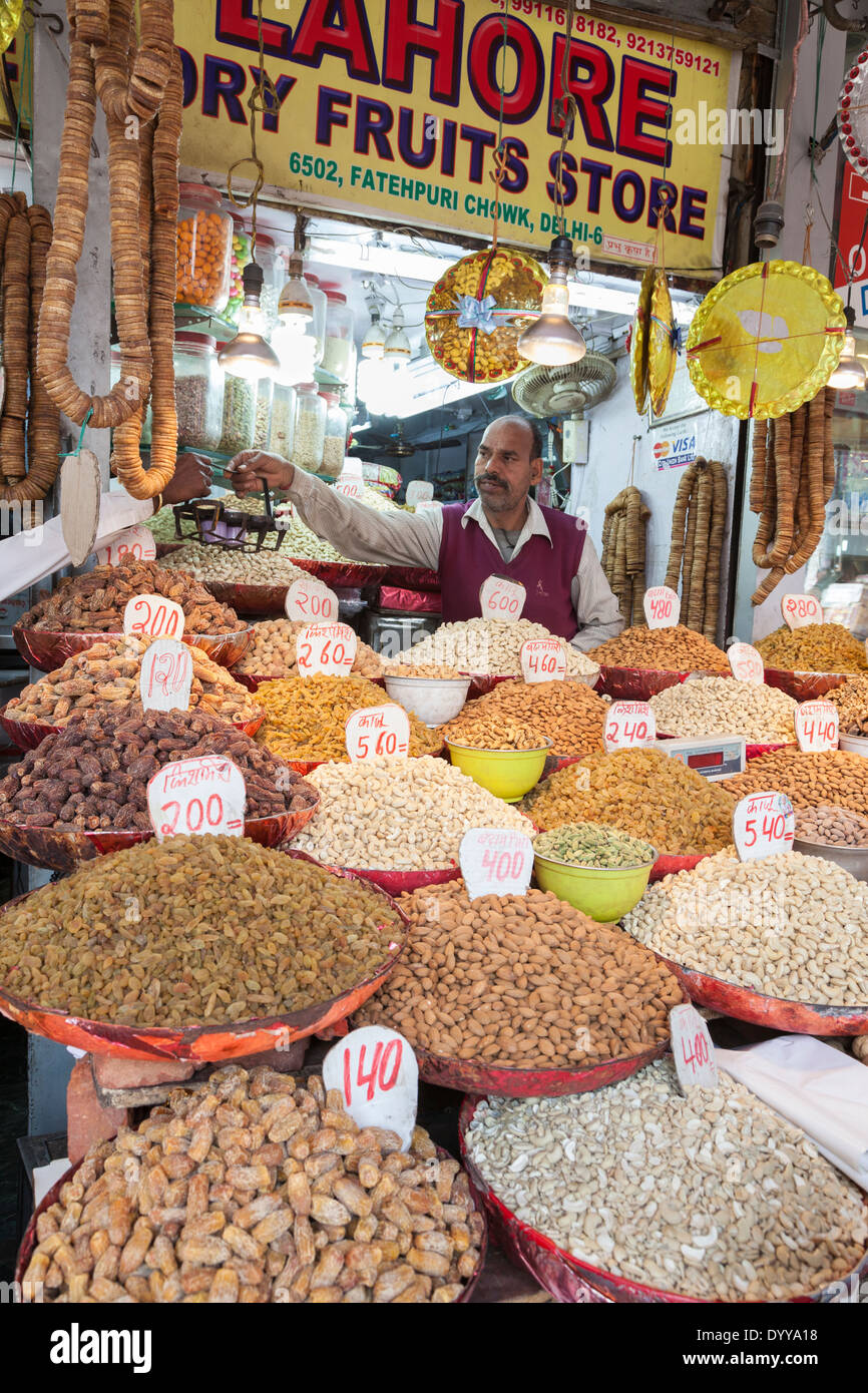 New Delhi, India. Dried Fruits and Nut Vendor in his Shop Stock Photo