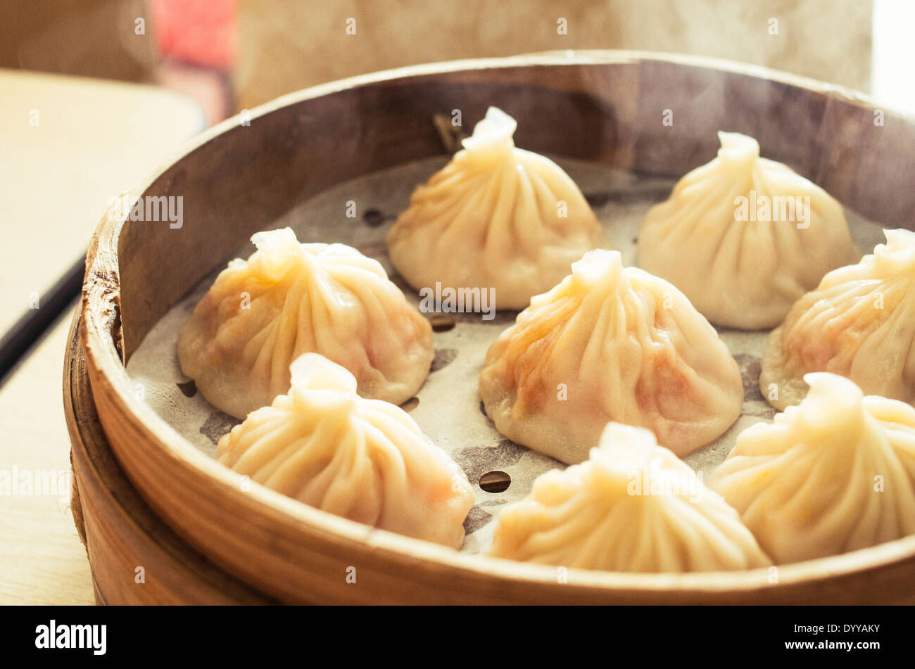 chinese dumplings or xiao long bao in bamboo tray, famous food in Shanghai, China. Stock Photo