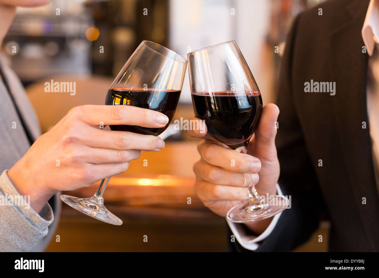 male female cheers alcohol bar Stock Photo