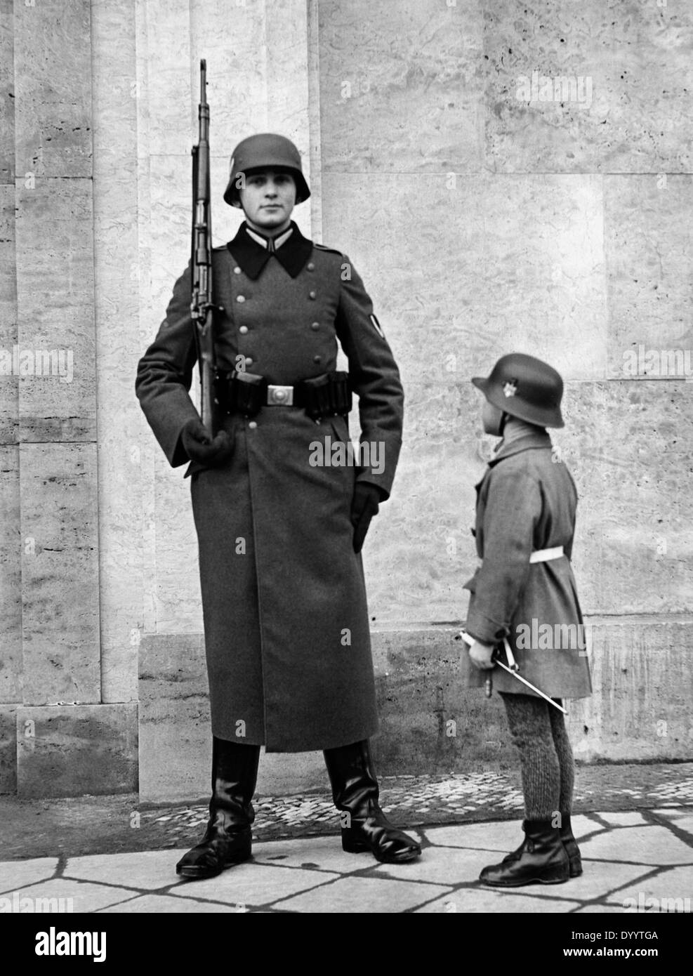 Wehrmacht soldier with boy, 1939 Stock Photo