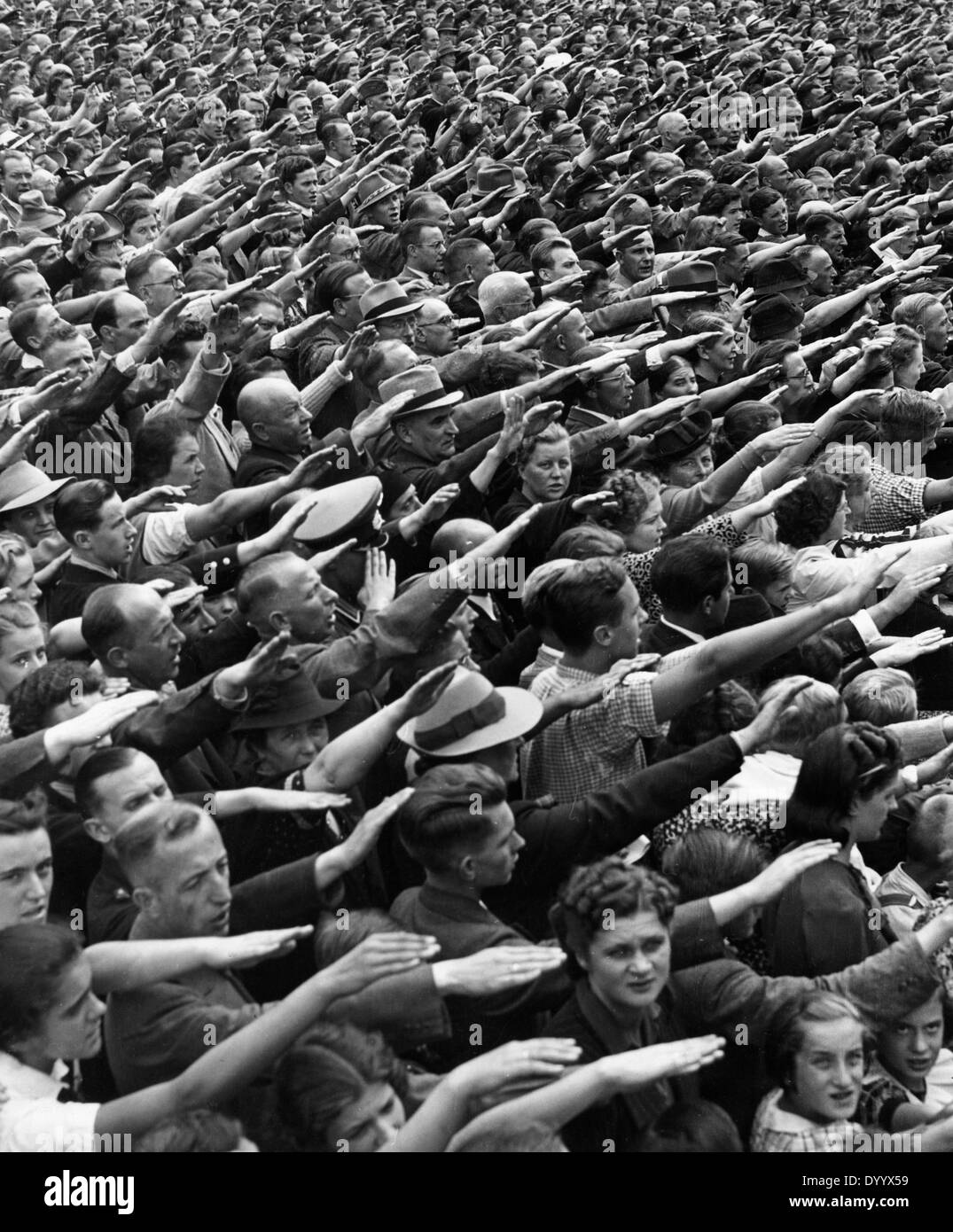People during Hitler's speech on the outbreak of war, 1939 Stock Photo