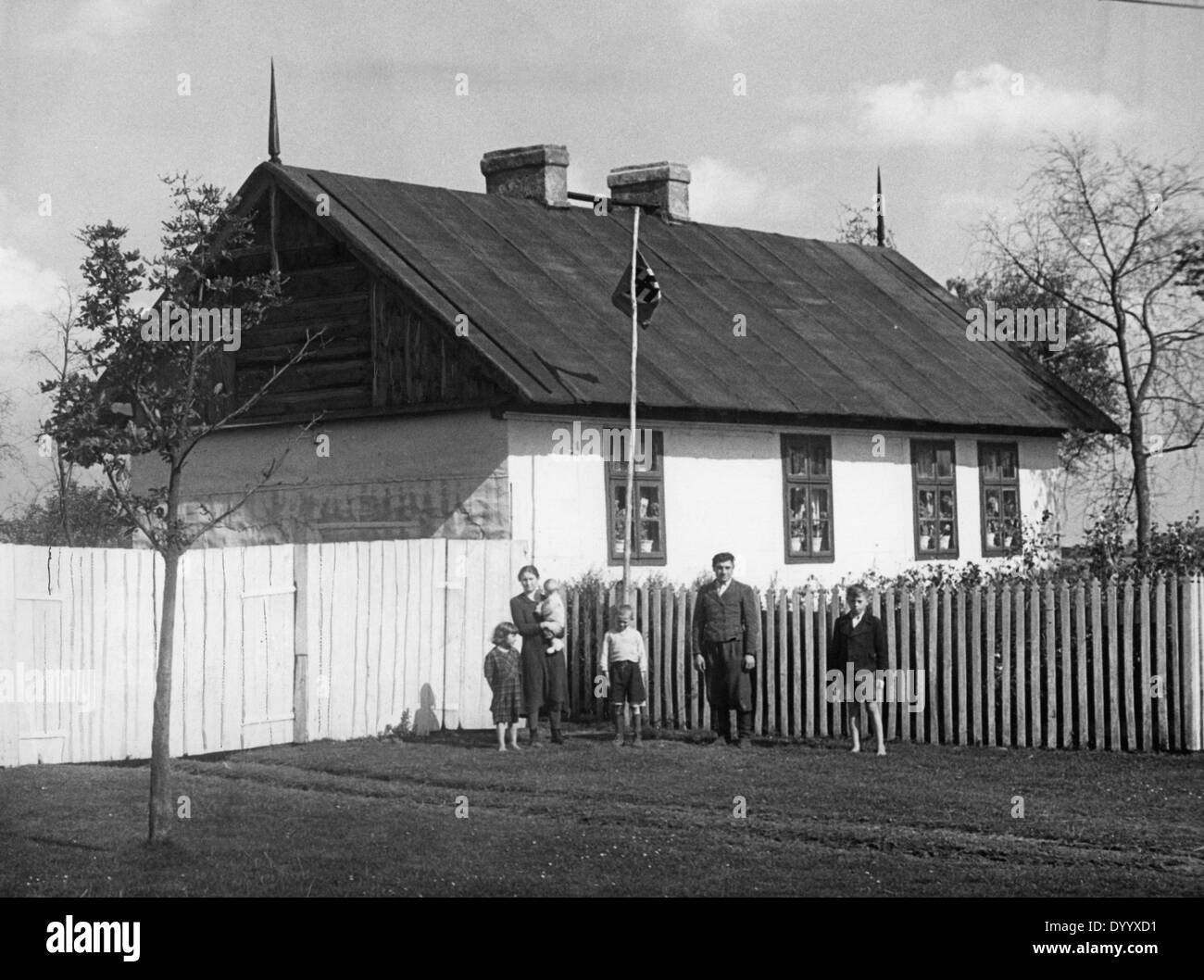 Ethnic German family in front of a house in the occupied Poland, 1940 Stock Photo