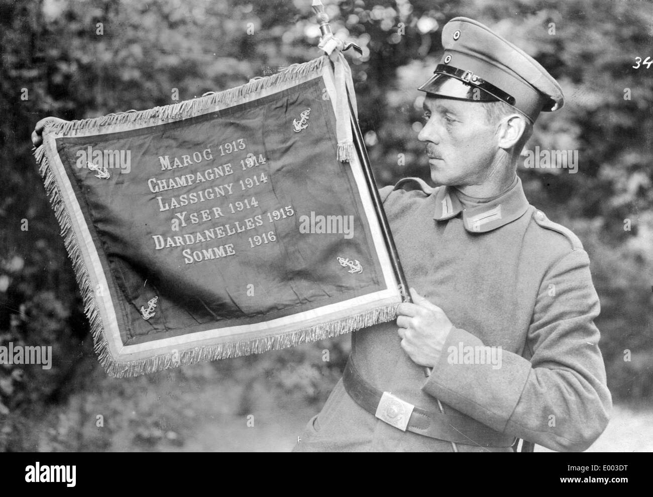 German soldier with captured enemy flag, 1917 Stock Photo