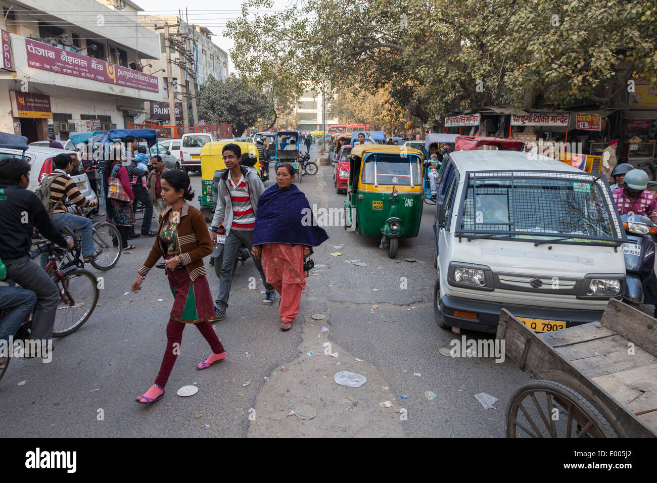 New Delhi, India. Vehicular and Pedestrian Traffic on a Busy Downtown Street. Stock Photo