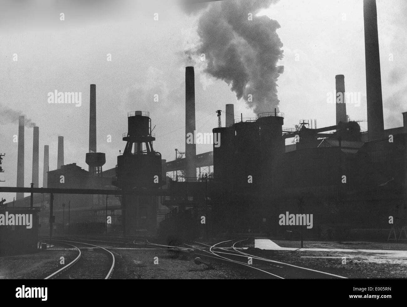 Smoking factory chimneys 1950s Black and White Stock Photos & Images