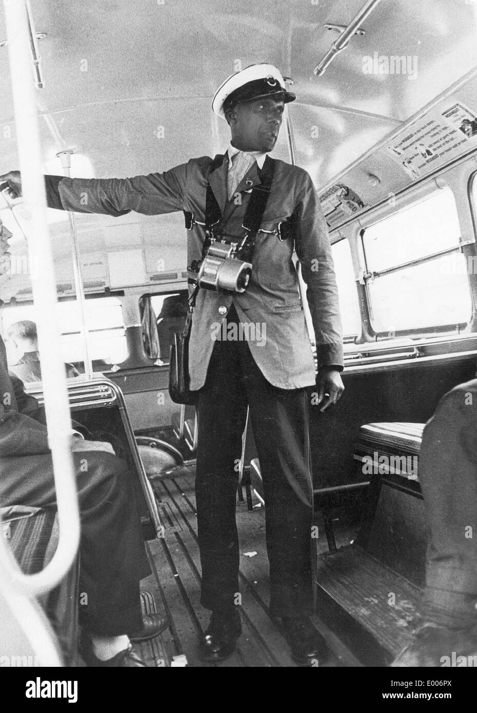 A colored bus conductor in London, 1958 Stock Photo