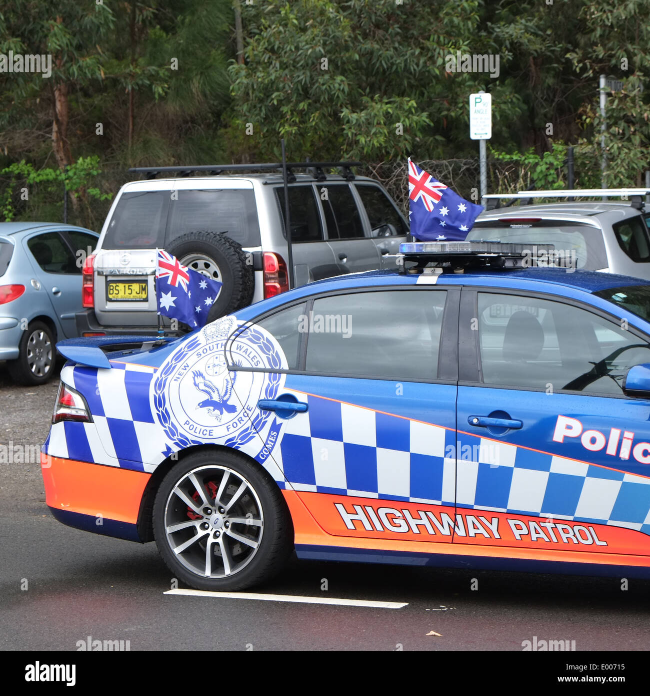 New south Wales Ford police car in palm beach,Sydney,Australia with australian parade flags attached to the car Stock Photo